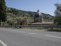 Scenic View of Tuscany Landscape with Church and Mountains in Italy