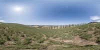 a panoramic picture of a landscape taken on a phone with a fish eye lens