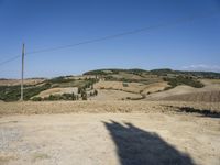 an image of a road in the country side view of the valley with trees and hills on either side