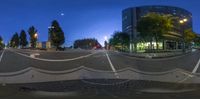 the 360 - view view camera is seen in the city at twilight as it passes through a roundabout