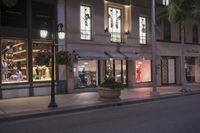 an empty storefront on a city street during twilight time hours in los angeles, california