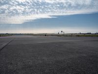 a jetliner sitting on top of an airport tarmac next to another jetliner