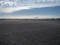 a jetliner sitting on top of an airport tarmac next to another jetliner