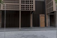 a fire hydrant on the sidewalk of a building next to a tree with wood beams
