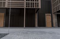 a fire hydrant on the sidewalk of a building next to a tree with wood beams