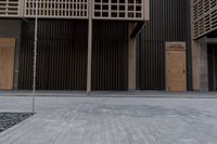 a fire hydrant on the sidewalk of a building next to a tree with wood beams
