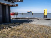 this is the image of an under construction walkway and walkway next to the water in the background