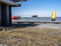 this is the image of an under construction walkway and walkway next to the water in the background