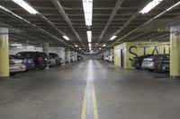 an underground parking garage with rows of cars parked in it's space that looks like it could have a lot of people going to work