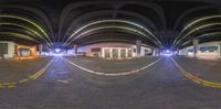 a fish eye view shows the inside of an underground parking space at night time to reveal a lot of light