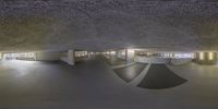 an empty underground room with multiple large circular mirrors and arches on walls, showing inside spaces with different shapes