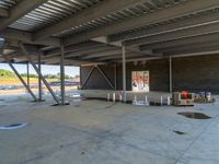 a room with a lot of unfinished materials and a lot of concrete on the floor