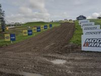 the dirt bike course at the track is muddy and ready for races and competitions or competitions