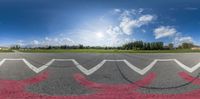 a view from the top looking into an upside down runway with a sky in the background