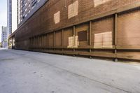 a street in an alley with two lanes full of brick and broken out doors and garbage on the ground