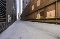 a street in an alley with two lanes full of brick and broken out doors and garbage on the ground