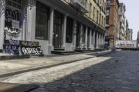 a sidewalk with some graffiti and a sign on it that says coffee and skateboards