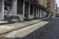 a sidewalk with some graffiti and a sign on it that says coffee and skateboards