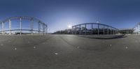 a series of three shots showing a roller coaster and other rides in the background while it sun shines