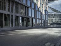 a road in front of buildings with a bike rack and a street light on the ground