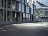 a road in front of buildings with a bike rack and a street light on the ground