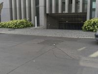 a fire hydrant is seen on a city street as it passes by the entrance