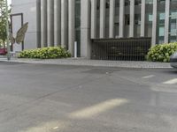 a fire hydrant is seen on a city street as it passes by the entrance