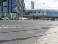 a large street and some tall buildings in the background with no people on it and no pedestrians