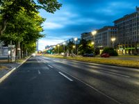 a car passing the stop light on an empty street, at twilight or dawn in a european city