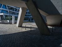 the building has several different angles on it, in varying colors and shapes with brick and concrete floors