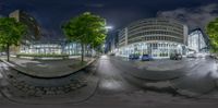 a 360 - view shows the streets with cars passing by at night, and tall buildings in the background