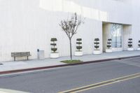 a fire hydrant on the side of a building with many seats to sit in