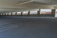 an empty parking garage with no people around it's rims and floors on both sides