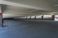 an empty parking garage with no people around it's rims and floors on both sides