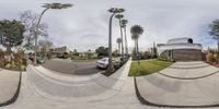 a picture taken with the fish eye lens of a skateboarder doing tricks in the street