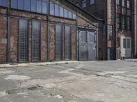 old building with a metal door and two doors at the top of it's rundown