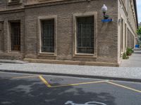 the side walk and walkway of a building is marked with markings for parking spaces below