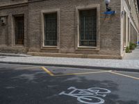 the side walk and walkway of a building is marked with markings for parking spaces below