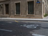 the side walk and walkway of a building is marked with markings for parking spaces below