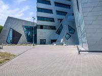 view of entrance and building from inside the building on a sunny day at an office complex