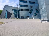 view of entrance and building from inside the building on a sunny day at an office complex