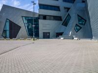 view of entrance and building from inside the building on a sunny day at an office complex