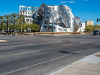 there is a building with silver and white coloring that looks like a rock on it