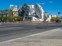 there is a building with silver and white coloring that looks like a rock on it