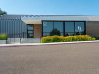 the building has glass doors that look like a small group of buildings in front of it