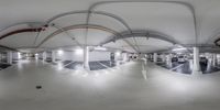 a circular image is of the inside of an empty garage space with two vans on each floor