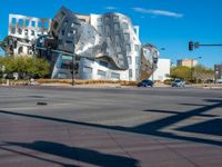 a person walking on the sidewalk in front of an interesting building in los angeles, california