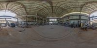 view from inside of an industrial building looking towards the ceiling and a track in the foreground