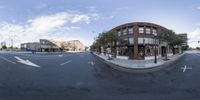 a street with multiple intersections and a very large building on it's side