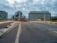 empty city street with traffic lights at night and building in the background in urban area